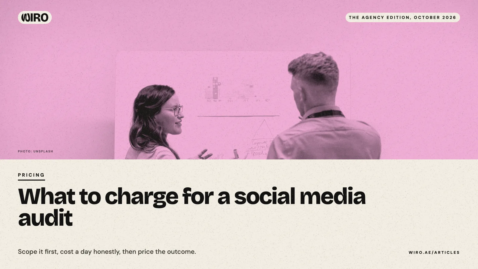 A cover with a pink-toned photo of two colleagues discussing charts at a whiteboard, above the headline about pricing an audit