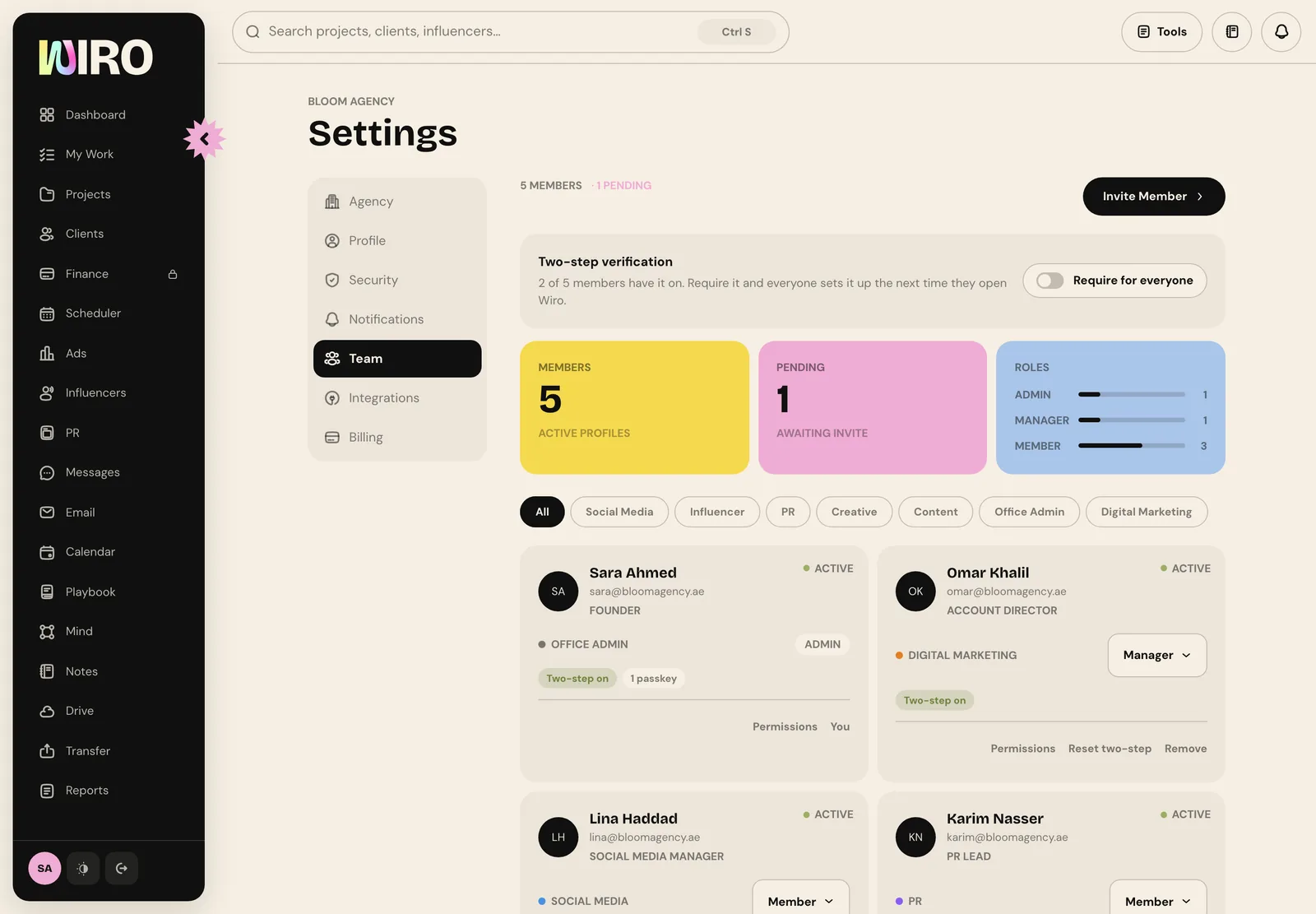 The Team tab with members, pending and roles counts, department filters and team member cards showing role and two-step status